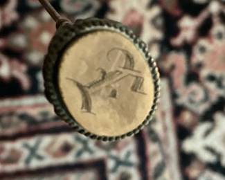 End of hat pin “E”