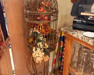 Large Metal Bird Cage with unique floral arrangement inside