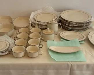 set of ivory porcelain dinnerware