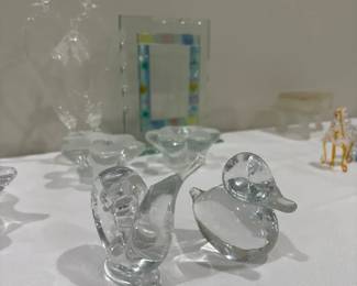 Mix lot of art glass figures candl holders , frame , decorative item etc. Condition is good . Mis