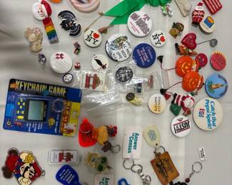 Mixed group of vintage pins and keychains PACMAN keychain game unopened.