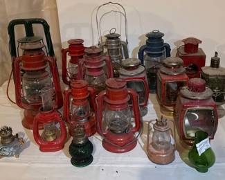 This collection features several vintage and antique kerosene and oilburning hurricane lanterns.