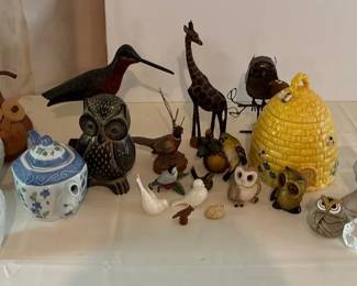 collection of decorative ceramic and wooden animal figurines