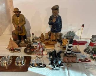 collection of nauticalthemed tabletop decor and figurines