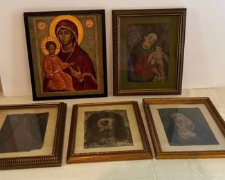Collection of framed Christian religious art and icons