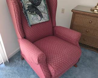 Rose wingback armchair with cabriole legs and woven throw