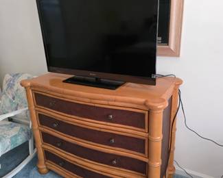 Bamboo and rattan 4-drawer chest with flat-screen TV, wall mirror