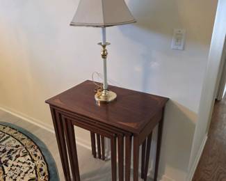 Mahogany nesting tables with brass and ivory table lamp
