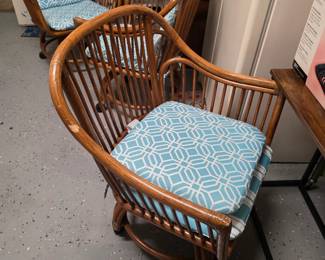 Set of vintage rattan barrel chairs with aqua geometric cushions