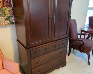 Dark wood TV armoire with 2 doors and 3 drawers