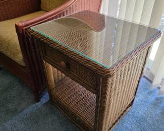 Wicker end table with glass top, drawer and lower shelf