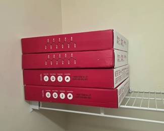 Closet shelf with 4 boxed sets of string lights