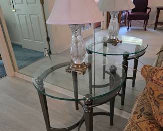 Round glass end table with metal base and crystal-style lamp