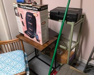 Storage corner: BackPleaser Ultra massage seat, tool case, rattan chair