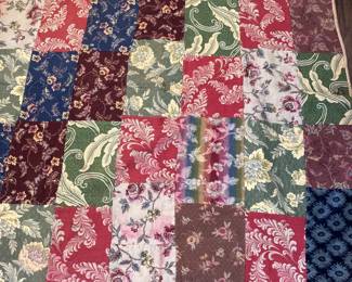 Beautiful old quilt made with upholstery type fabric