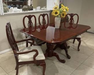 Another view - Dining table w/ four chairs.  Seat covers need some 'love'
