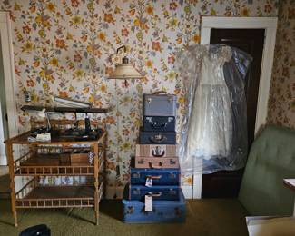 Vintage suitcases, desk lamps, 1955 wedding gown