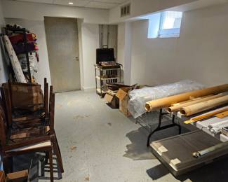 Old maps, vintage folding chairs, Smith Corona Typewriter, old yardsticks, T squares, cart