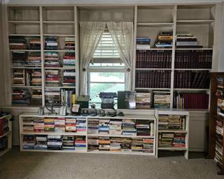 Books, book cases, vintage adding machine, antique hole punches