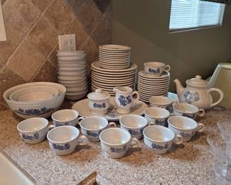 Large vintage stoneware serving ware collection with plates, bowls, cups, and serving pieces. 