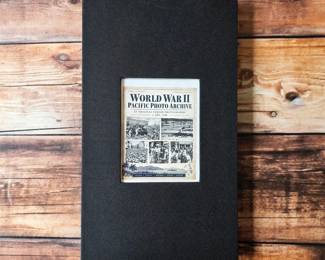 WWII Pacific photographic archive: 33 period black-and-white photographs presented in an album and offered together.