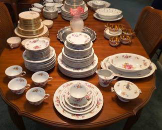 Harmony House Dresdania floral china, including dinnerware, cups, saucers, creamer and covered sugar bowl.