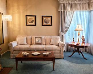 Traditional striped sofa, wood coffee table, pedestal side table and decorative lighting