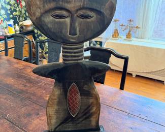 traditional Akua'ba (fertility doll), likely hand-carved from wood in the style of the Ashanti (Akan) people of Ghana