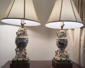 vintage Capodimonte-style porcelain table lamp featuring sculpted cherubs and a hand-painted landscape medallion