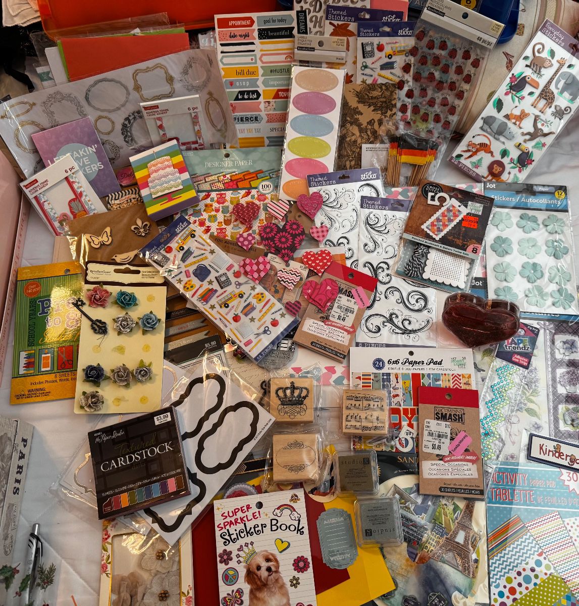 Scrapbooking and craft supplies including stickers and cardstock