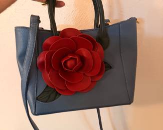 This leather purse with leather rose embellishment is SO SOFT and so pretty. Like new.