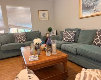 Beautiful slate blue couch and love seat set / coffee table that has a top that rises up