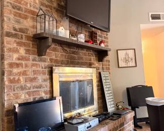Flat screen tv with wall mount, plenty of other electronics and media stuff