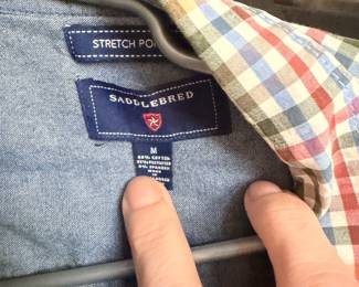 Medium sized and large sized dress shirts an ton of t-shirts.