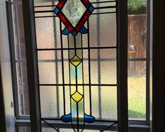 Large window panel Arts & Crafts style stained glass, there are two identical pieces