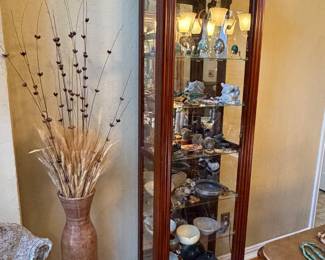 Tall, lighted curio cabinet with sliding/locking door