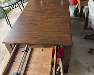 Table has two retractable leaves built in