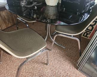 Chrome dining table with smoky glass top 