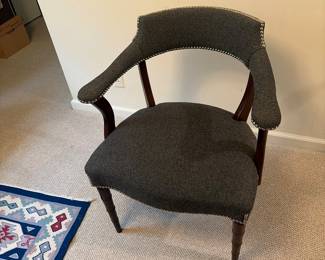 Navy blue upholstered chairs with decorative tacks