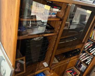 VHS tapes and display cabinet with stereo components