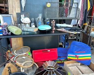 Vintage tennis rackets, 1800’s magazines, vintage bow ties, Tiffany glass lampshade