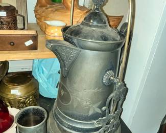 ANTIQUE SILVERPLATED TILTING PITCHER