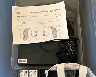 Multiple sets of Opticon hearing aids. 