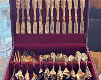 Baroque pattern flatware by Godinger service for twelve with serving pieces. 