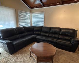 Beautiful leather wall hugging reclining sectional. Must see ! 
