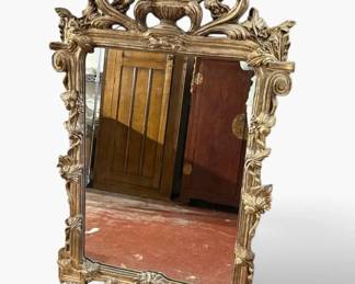 Ornate, carved giltwood mirror