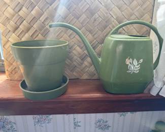 Vintage green plastic flowerpot and watering can