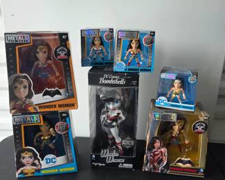 Cryptozoic DC Bombshells "Noir Edition" Wonder Woman Vinyl Figure (Center) $20,Jada Metals Die Cast 4" Wonder Woman Figures (Bottom Left #M363 & Bottom Right #M3)$10 each, Jada Metals Die Cast 4" "Batman v Superman" Wonder Woman (Top Left #M7) $ 10,  Jada Metals 2.5" Mini Figures (Top Center Duo & Top Right Metalfigs) $5 each