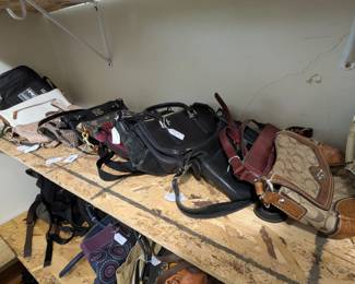 Purses in many styles including clutch, wristlet, crossbody, hobo, and backpack, including brand names Coach, Fossil, Michael Kors, Kate Spade, Mimeo, many leather purses, and others as well!