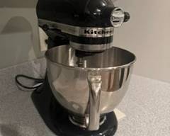 Kitchen Aid mixer with multiple attachments. 